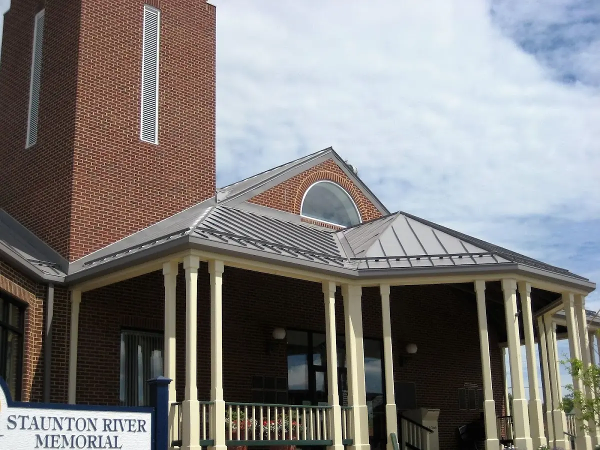 Skilled roofing craftsmen working on a residential roof in Russells Point